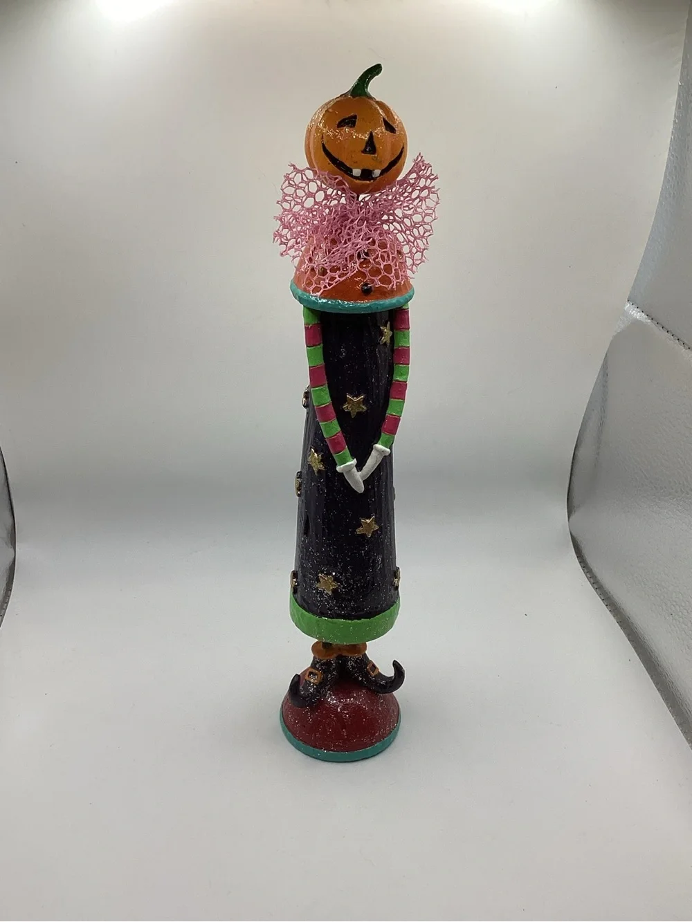 whimsical folk-art Halloween figurine jack-o-lantern head, witch shoes